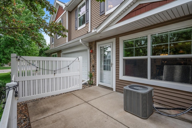 3474 White Pine Way, Stillwater, MN 55082 - view of patio with central air condition unit and an attached garage