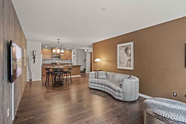 3474 White Pine Way, Stillwater, MN 55082 - living room with a chandelier, dark wood-style flooring, and baseboards