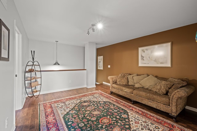 3474 White Pine Way, Stillwater, MN 55082 - living area featuring wood finished floors, baseboards, and rail lighting