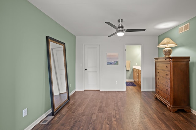 3474 White Pine Way, Stillwater, MN 55082 - unfurnished bedroom featuring dark wood-type flooring, baseboards, ensuite bath, and a ceiling fan