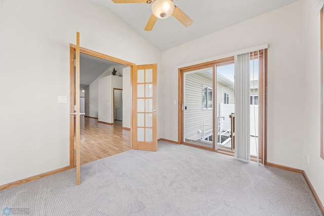 4388 52nd St S, Fargo, ND 58104 - carpeted spare room featuring vaulted ceiling, french doors, and a ceiling fan