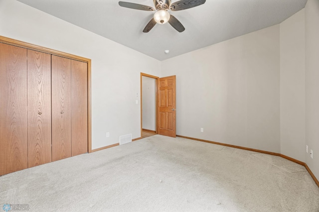 4388 52nd St S, Fargo, ND 58104 - unfurnished bedroom with carpet flooring, a closet, and a ceiling fan