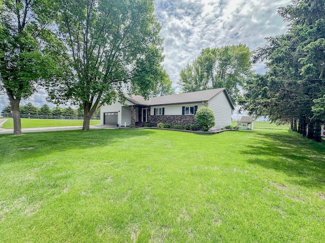 731 Grove Ave, Bird Island, MN 55310 - single story home with an attached garage, driveway, and a front yard
