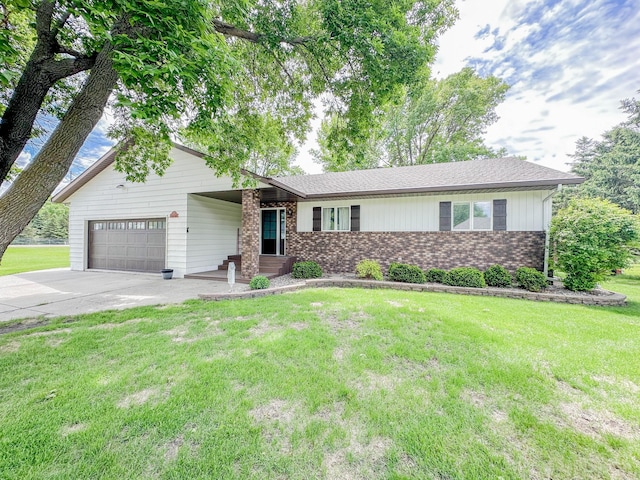 731 Grove Ave, Bird Island, MN 55310 - view of front facade with brick siding, a garage, driveway, and a front yard