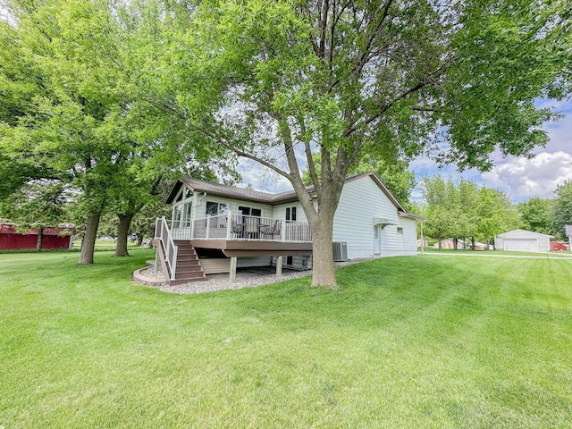 731 Grove Ave, Bird Island, MN 55310 - back of property featuring a deck, a lawn, central air condition unit, and stairs