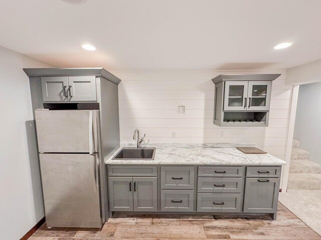 731 Grove Ave, Bird Island, MN 55310 - kitchen featuring gray cabinets, a sink, freestanding refrigerator, and recessed lighting