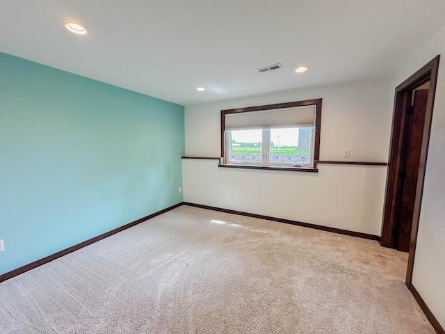 731 Grove Ave, Bird Island, MN 55310 - unfurnished bedroom with carpet, recessed lighting, and baseboards