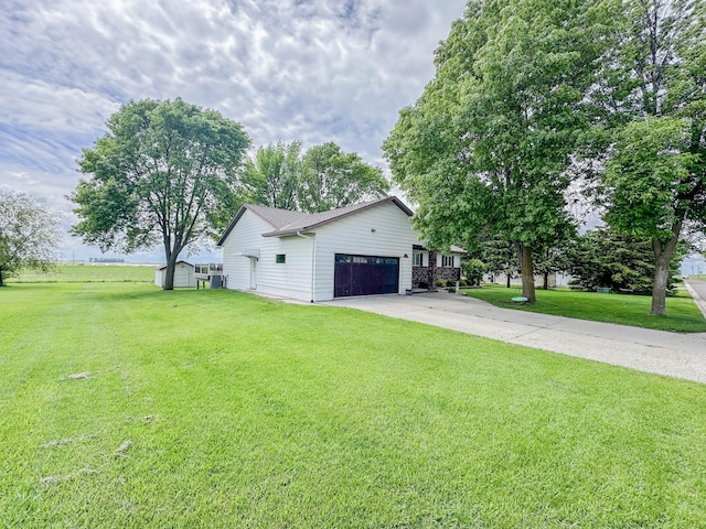 731 Grove Ave, Bird Island, MN 55310 - view of home's exterior featuring an attached garage, a lawn, and driveway