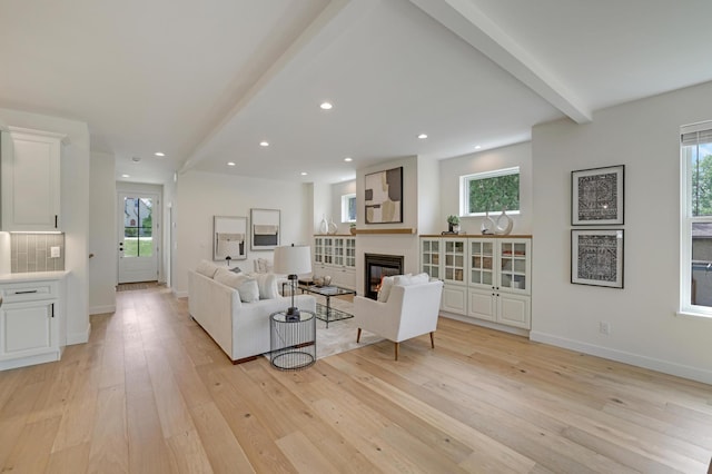4804 12th Ave S, Minneapolis, MN 55417 - living area with light wood-style floors, a glass covered fireplace, baseboards, beamed ceiling, and recessed lighting