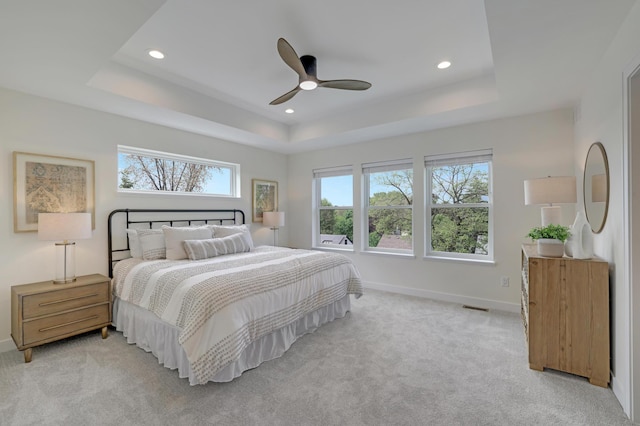 4804 12th Ave S, Minneapolis, MN 55417 - bedroom featuring a tray ceiling, multiple windows, light carpet, and recessed lighting