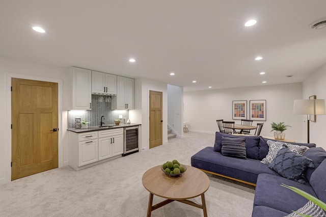 4804 12th Ave S, Minneapolis, MN 55417 - living area featuring wine cooler, bar with sink, recessed lighting, light carpet, and stairs