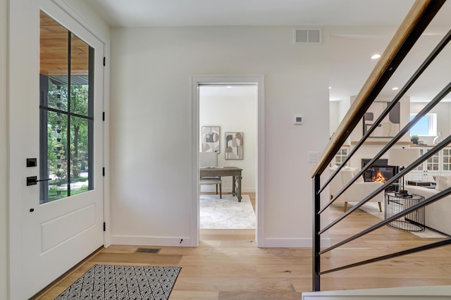 4804 12th Ave S, Minneapolis, MN 55417 - foyer entrance with stairway, healthy amount of natural light, light wood-style floors, baseboards, and recessed lighting