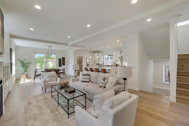 4804 12th Ave S, Minneapolis, MN 55417 - living area featuring light wood-type flooring, recessed lighting, stairway, and a chandelier