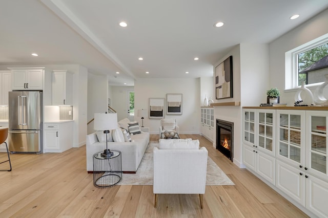 4804 12th Ave S, Minneapolis, MN 55417 - living room with a glass covered fireplace, light wood-style floors, recessed lighting, and baseboards