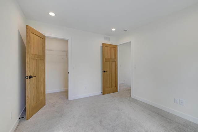4804 12th Ave S, Minneapolis, MN 55417 - unfurnished bedroom featuring a spacious closet, recessed lighting, light colored carpet, baseboards, and a closet