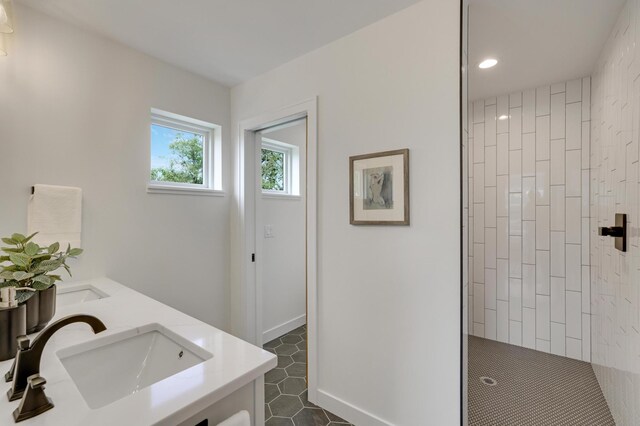 4804 12th Ave S, Minneapolis, MN 55417 - full bathroom featuring double vanity, tiled shower, recessed lighting, and tile patterned flooring