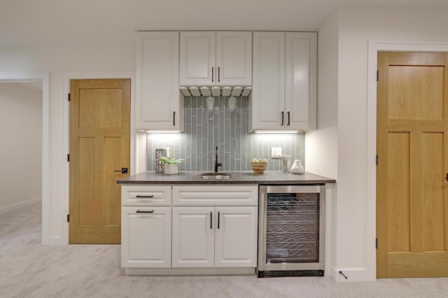 4804 12th Ave S, Minneapolis, MN 55417 - indoor wet bar with wine cooler, decorative backsplash, baseboards, and light carpet