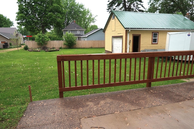 663B Main St, Ellsworth, WI 54011 - view of yard featuring an outdoor structure and a detached garage