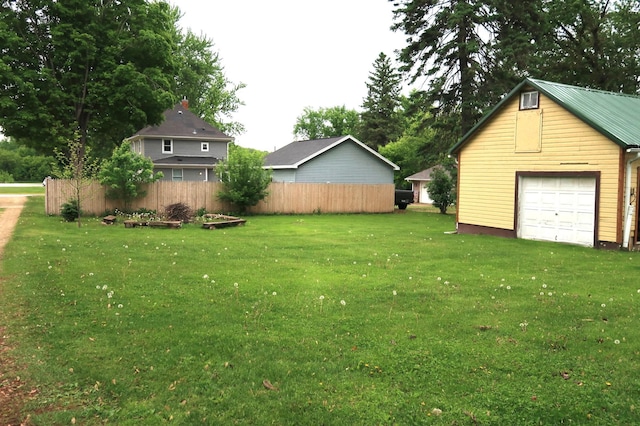 663B Main St, Ellsworth, WI 54011 - view of yard with a detached garage