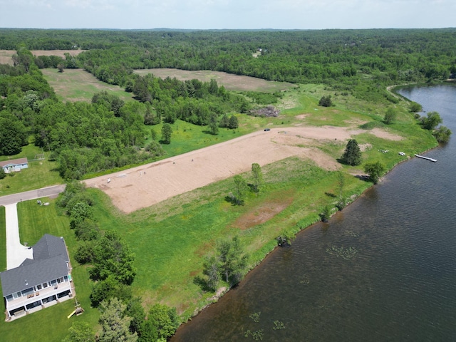1625 Lake Ave, Luck, WI 54853 - aerial overview of property's location with a nearby body of water and a heavily wooded area
