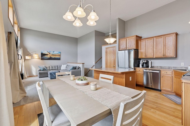 9741 Saint Andrews Dr, Elko New Market, MN 55020 - dining space with light wood-type flooring and a chandelier