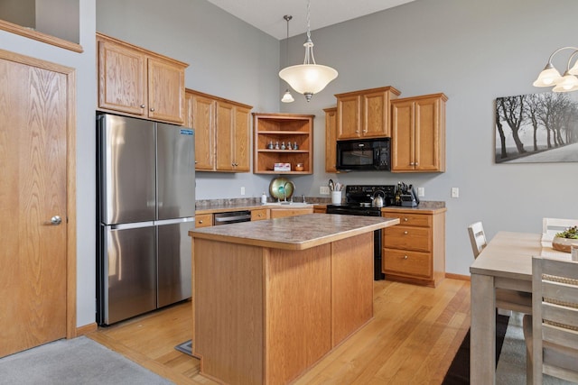 9741 Saint Andrews Dr, Elko New Market, MN 55020 - kitchen with black appliances, open shelves, light wood-type flooring, a kitchen island, and a high ceiling