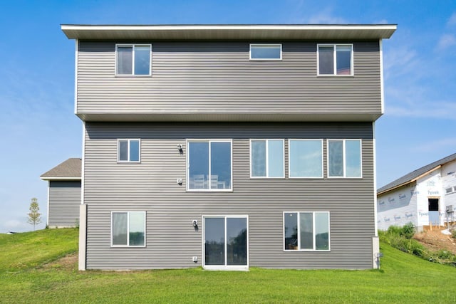 23615 Underclift St NW, Saint Francis, MN 55070 - rear view of property with a lawn