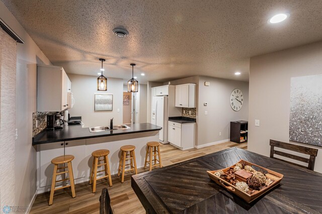1156 42nd Ave W Unit A, West Fargo, ND 58078 - dining area featuring light wood-style floors, recessed lighting, and baseboards