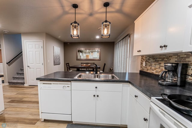 1156 42nd Ave W Unit A, West Fargo, ND 58078 - kitchen featuring white appliances, a sink, a peninsula, dark countertops, and tasteful backsplash