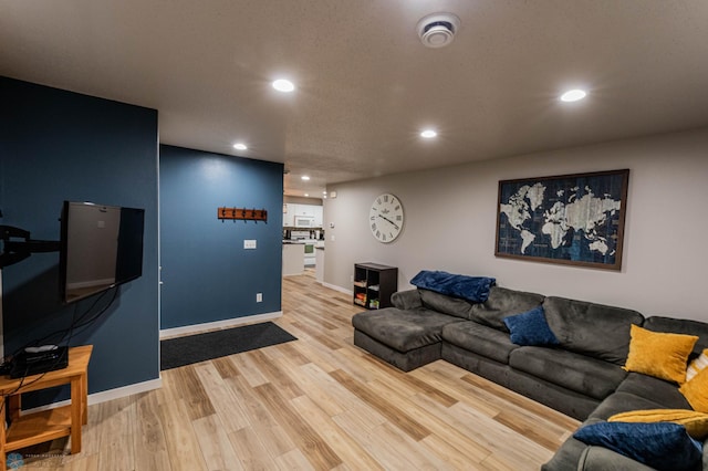 1156 42nd Ave W Unit A, West Fargo, ND 58078 - living area with recessed lighting, light wood-style floors, and baseboards