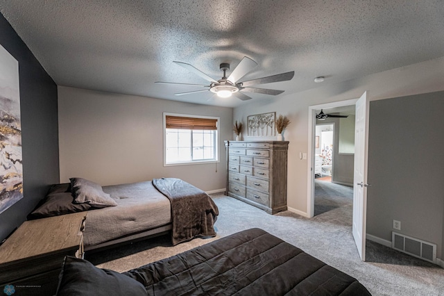 1156 42nd Ave W Unit A, West Fargo, ND 58078 - carpeted bedroom featuring a textured ceiling, a ceiling fan, and baseboards