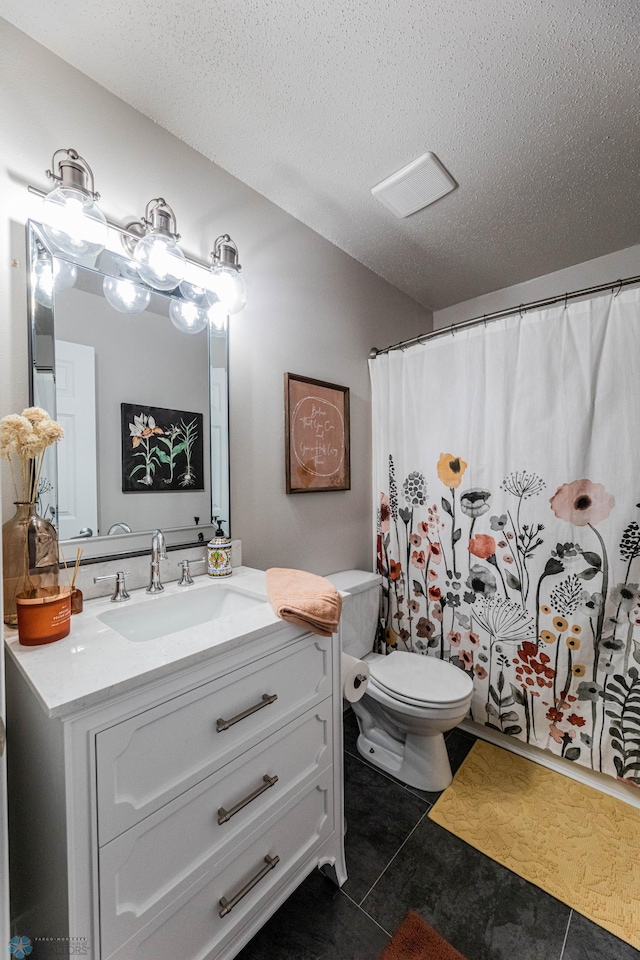 1156 42nd Ave W Unit A, West Fargo, ND 58078 - full bath featuring tile patterned floors, vanity, toilet, a textured ceiling, and curtained shower