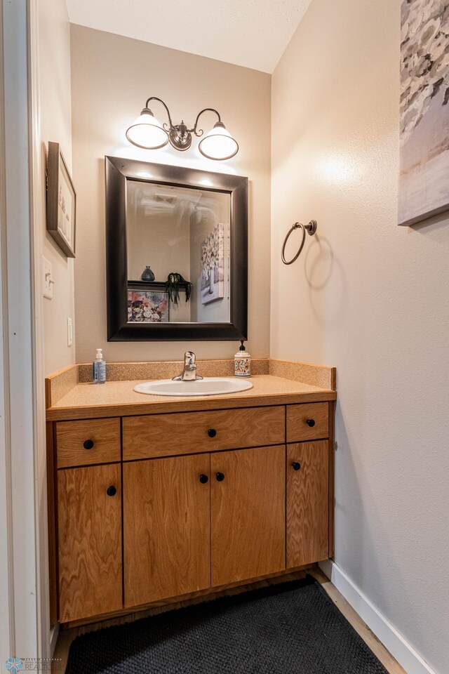 1156 42nd Ave W Unit A, West Fargo, ND 58078 - bathroom featuring vanity and baseboards