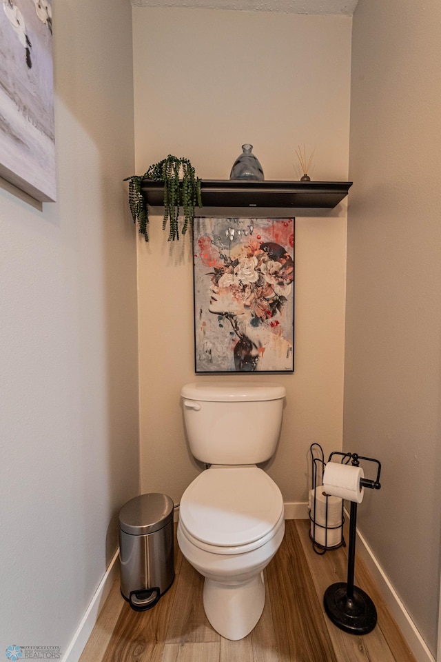 1156 42nd Ave W Unit A, West Fargo, ND 58078 - half bath with wood finished floors, toilet, and baseboards