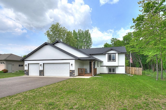 454 Roosevelt Dr, Dresser, WI 54009 - view of front of home featuring driveway, an attached garage, and stone siding