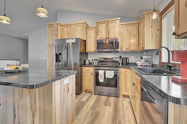 454 Roosevelt Dr, Dresser, WI 54009 - kitchen with appliances with stainless steel finishes, light brown cabinetry, dark countertops, lofted ceiling, and a sink