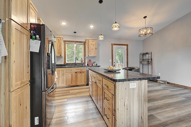 454 Roosevelt Dr, Dresser, WI 54009 - kitchen with black fridge with ice dispenser, dark countertops, light brown cabinetry, light wood-type flooring, and recessed lighting