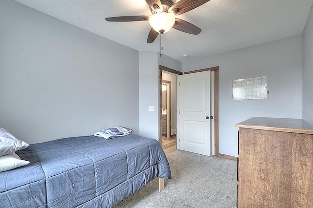 454 Roosevelt Dr, Dresser, WI 54009 - bedroom with light colored carpet, a ceiling fan, a textured ceiling, and baseboards