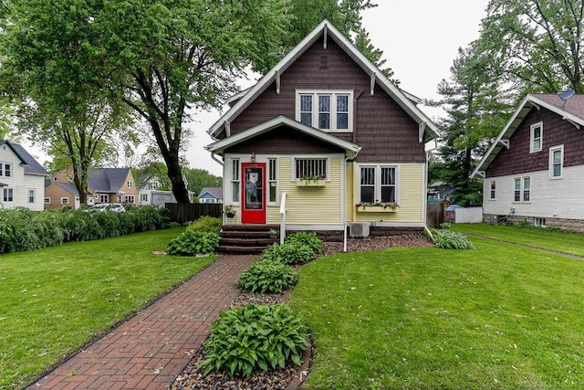 1280 8th Ave, Baldwin, WI 54002 - view of front facade featuring central AC and a front yard