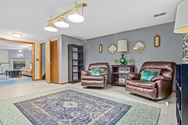 18905 Yalta St NE, East Bethel, MN 55092 - living area with a fireplace, a textured ceiling, and baseboards
