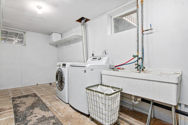 18905 Yalta St NE, East Bethel, MN 55092 - laundry room featuring independent washer and dryer and stone tile floors