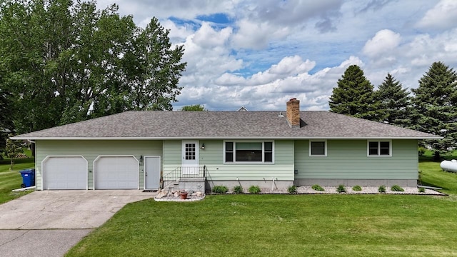 507 5th St NW, Barnesville, MN 56514 - ranch-style house featuring concrete driveway, a garage, a front lawn, and a chimney