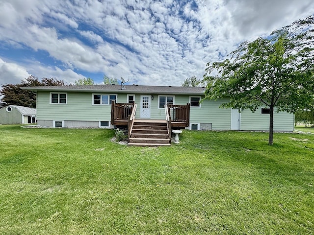 507 5th St NW, Barnesville, MN 56514 - rear view of house with a wooden deck and a lawn
