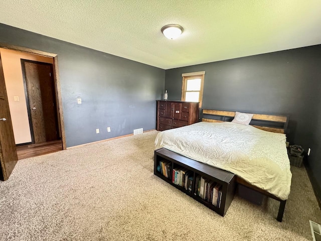 507 5th St NW, Barnesville, MN 56514 - bedroom with carpet, a textured ceiling, and baseboards