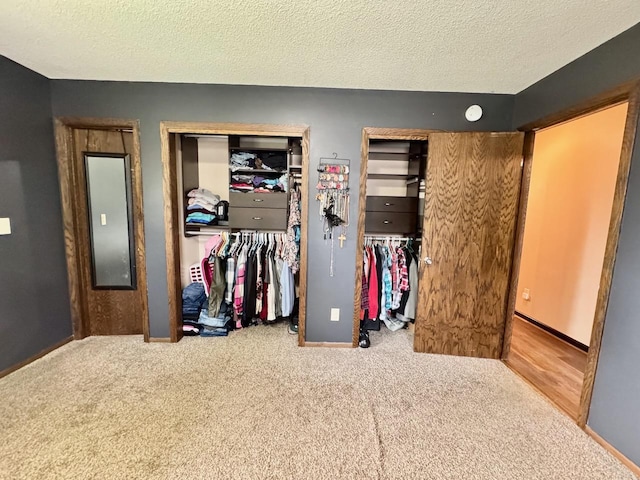 507 5th St NW, Barnesville, MN 56514 - carpeted bedroom with two closets, a textured ceiling, and baseboards