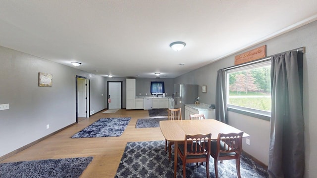 1175 Maben Ave S, Isle, MN 56342 - dining room featuring light wood-type flooring and baseboards