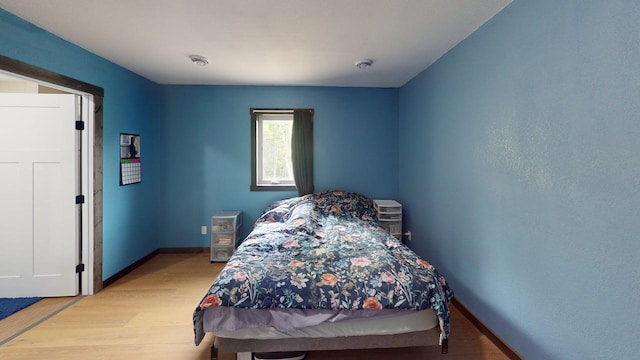 1175 Maben Ave S, Isle, MN 56342 - bedroom with wood finished floors and baseboards