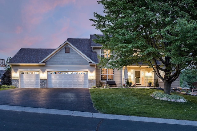 2040 Fountain Ln, Waconia, MN 55387 - craftsman-style home with stone siding, driveway, a garage, and a lawn