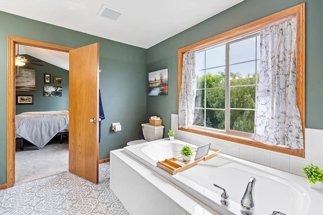 2040 Fountain Ln, Waconia, MN 55387 - bathroom featuring a garden tub, ensuite bath, and a ceiling fan