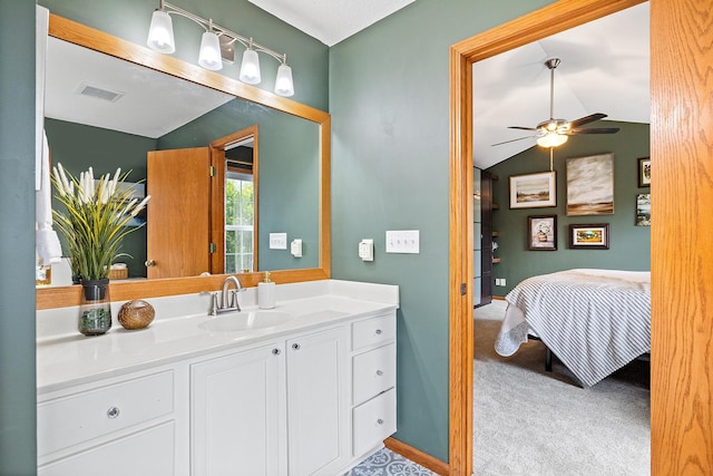 2040 Fountain Ln, Waconia, MN 55387 - ensuite bathroom featuring vanity, a ceiling fan, and lofted ceiling